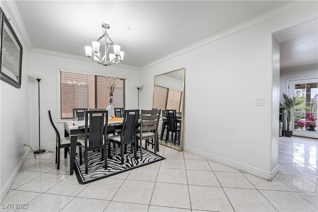 dining room featuring crown molding, light tile patterned floors, baseboards, and a notable chandelier