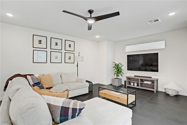 living area featuring baseboards, a ceiling fan, visible vents, and recessed lighting