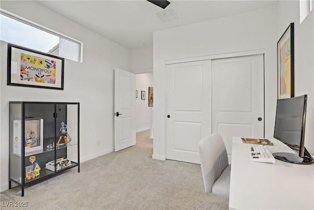 office with baseboards, light carpet, and visible vents