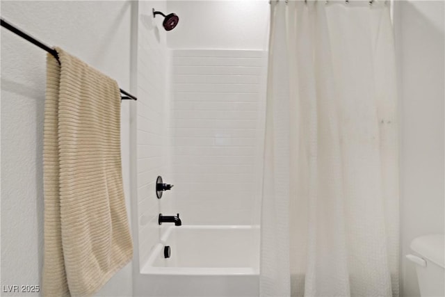 full bath with toilet and shower / bath combo