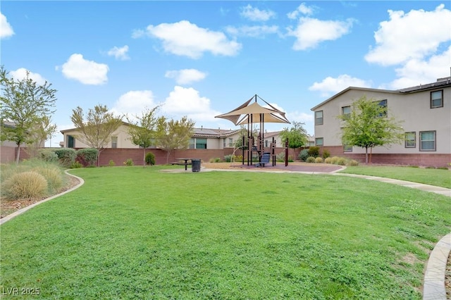 view of yard with playground community and fence