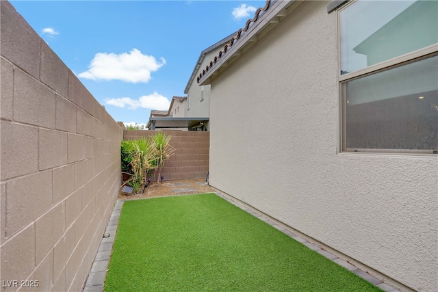 view of yard with fence