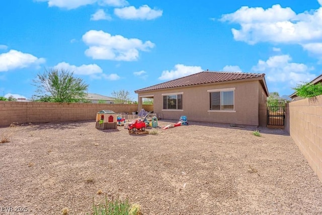 9590 Smiley Creek St, Las Vegas, NV 89178 - rear view of house featuring a patio, a fenced backyard, stucco siding, and a tile roof