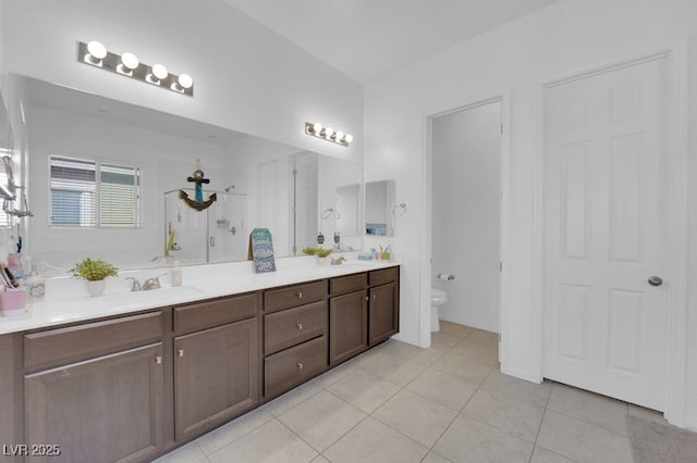 9590 Smiley Creek St, Las Vegas, NV 89178 - full bath featuring a sink, double vanity, a shower, toilet, and tile patterned flooring