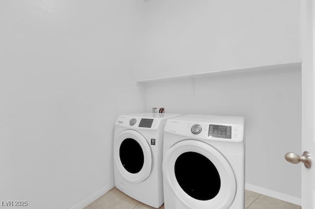 9590 Smiley Creek St, Las Vegas, NV 89178 - clothes washing area featuring washer and clothes dryer, baseboards, light tile patterned flooring, and laundry area