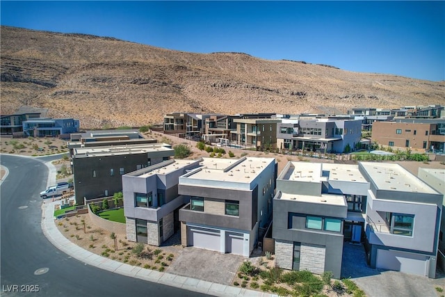 drone / aerial view with a mountain view and a residential view