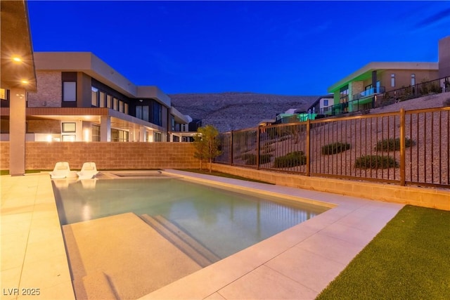view of swimming pool with a fenced backyard and a fenced in pool