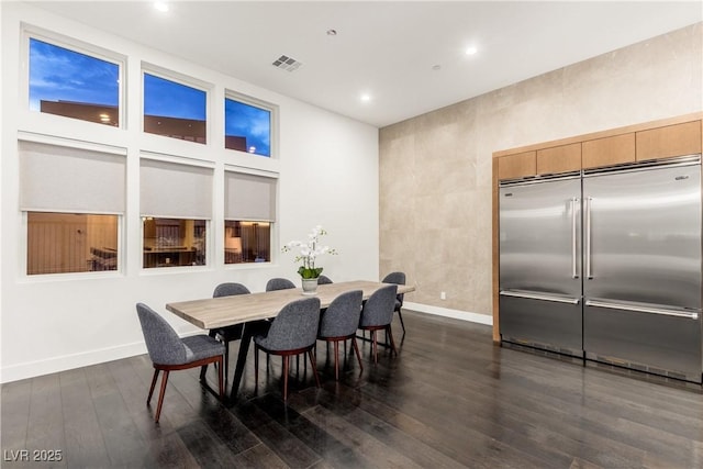 dining area featuring dark wood-type flooring, recessed lighting, visible vents, and baseboards