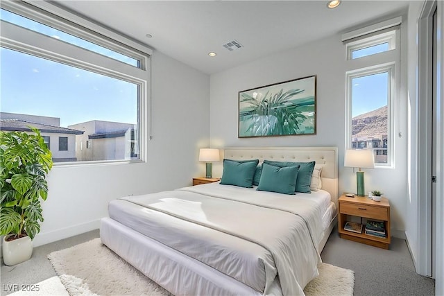 bedroom with carpet flooring, recessed lighting, visible vents, and baseboards