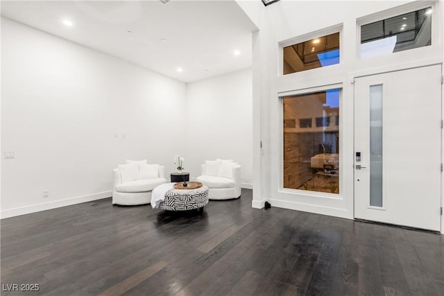 sitting room featuring wood finished floors, recessed lighting, and baseboards