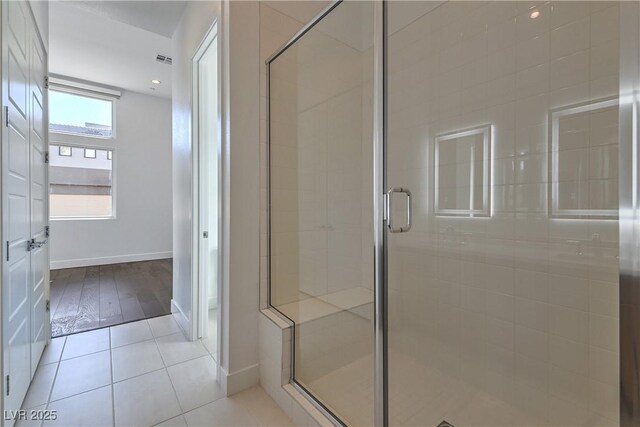 full bathroom with recessed lighting, a stall shower, visible vents, baseboards, and tile patterned flooring