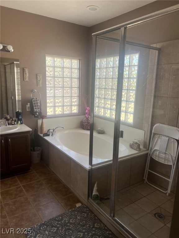 6596 Secluded Ave, Las Vegas, NV 89110 - bathroom with vanity, a bath, tile patterned floors, and a shower stall