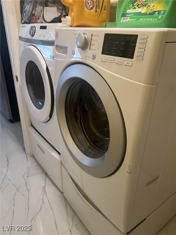 6596 Secluded Ave, Las Vegas, NV 89110 - laundry area featuring light marble finish floors and washing machine and clothes dryer