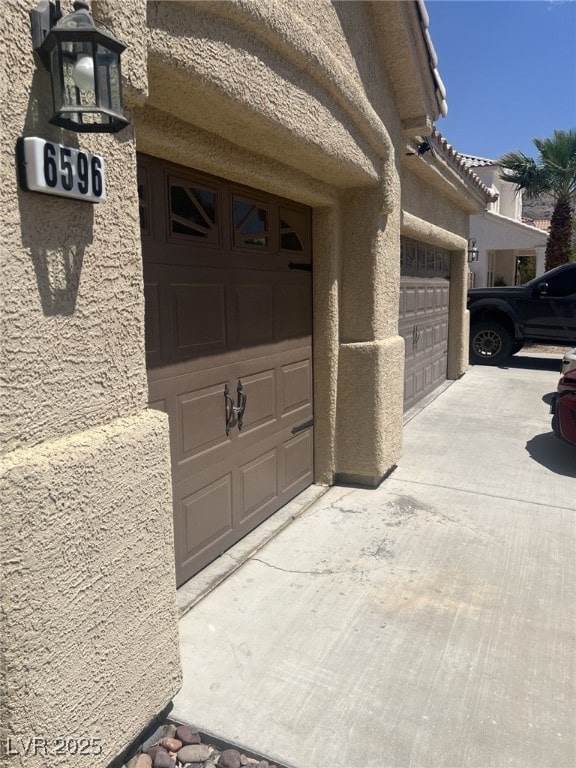 6596 Secluded Ave, Las Vegas, NV 89110 - garage featuring driveway