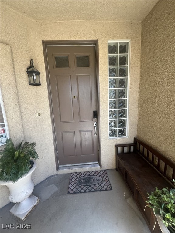 6596 Secluded Ave, Las Vegas, NV 89110 - view of exterior entry featuring stucco siding