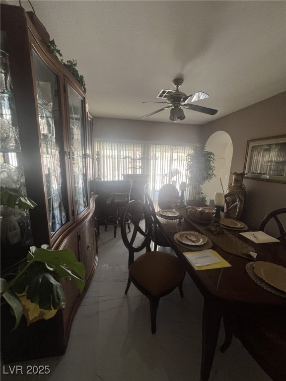 6596 Secluded Ave, Las Vegas, NV 89110 - dining room featuring a ceiling fan and light marble finish floors