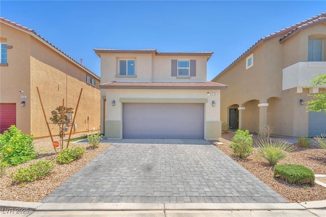 9198 Rolling Sky Dr, Las Vegas, NV 89178 - traditional-style home with stucco siding, an attached garage, decorative driveway, and a tiled roof