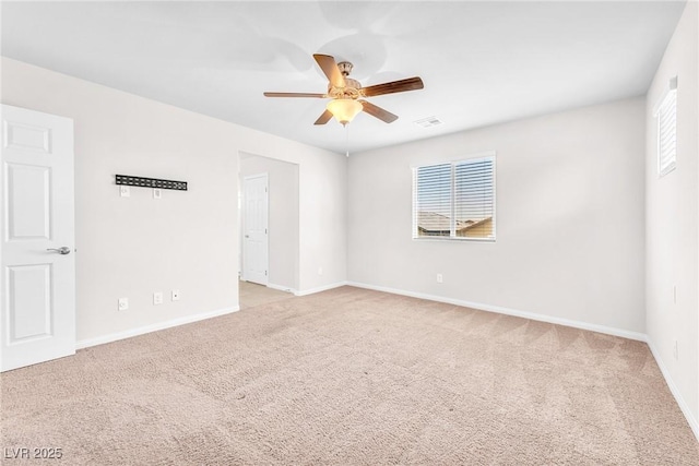 9198 Rolling Sky Dr, Las Vegas, NV 89178 - empty room featuring ceiling fan, light colored carpet, and baseboards