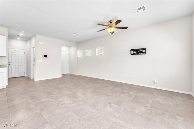 9198 Rolling Sky Dr, Las Vegas, NV 89178 - unfurnished living room with ceiling fan and baseboards