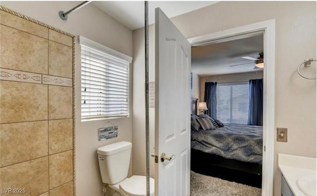 bathroom featuring toilet, ensuite bathroom, and a ceiling fan