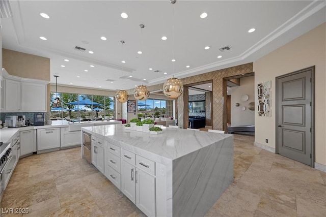 9301 Verlaine Ct, Las Vegas, NV 89145 - kitchen featuring white cabinets, a large island, and visible vents