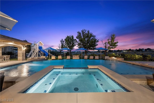 9301 Verlaine Ct, Las Vegas, NV 89145 - outdoor pool featuring an in ground hot tub, a water slide, and a patio
