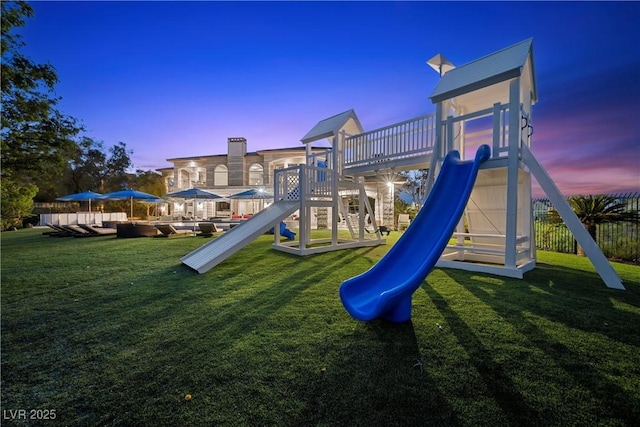 9301 Verlaine Ct, Las Vegas, NV 89145 - playground at dusk with a playground, a yard, and fence