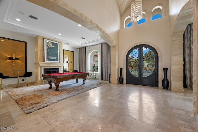 9301 Verlaine Ct, Las Vegas, NV 89145 - entryway with french doors, recessed lighting, an inviting chandelier, arched walkways, and billiards