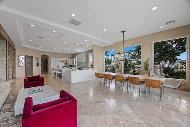 9301 Verlaine Ct, Las Vegas, NV 89145 - interior space featuring arched walkways, recessed lighting, a chandelier, and visible vents