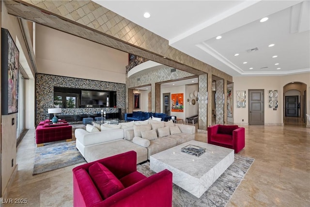 9301 Verlaine Ct, Las Vegas, NV 89145 - living area featuring arched walkways, visible vents, and recessed lighting
