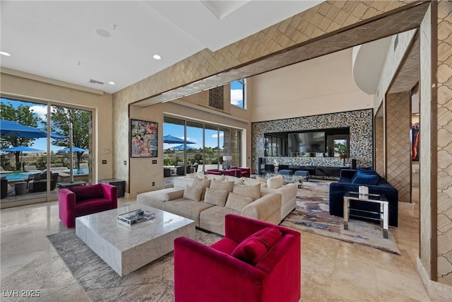 9301 Verlaine Ct, Las Vegas, NV 89145 - living room featuring visible vents, a towering ceiling, and recessed lighting