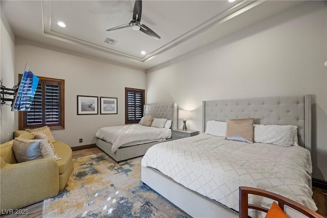 9301 Verlaine Ct, Las Vegas, NV 89145 - bedroom with a raised ceiling, recessed lighting, visible vents, and wood finished floors