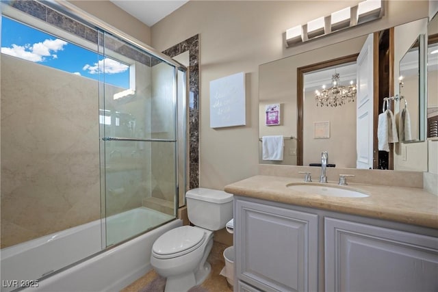 9301 Verlaine Ct, Las Vegas, NV 89145 - full bath with an inviting chandelier, toilet, enclosed tub / shower combo, and vanity