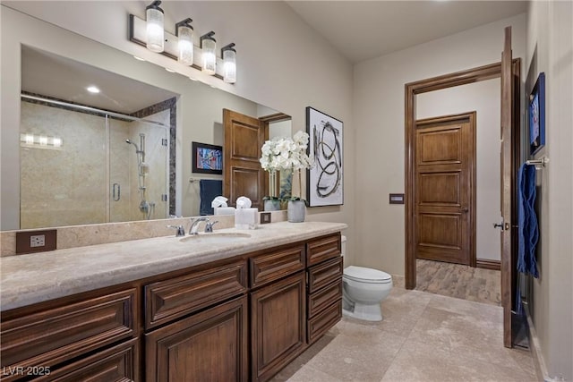 9301 Verlaine Ct, Las Vegas, NV 89145 - bathroom featuring vanity, baseboards, toilet, and a stall shower