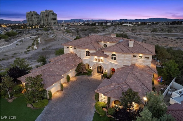 9301 Verlaine Ct, Las Vegas, NV 89145 - aerial view at dusk with a mountain view