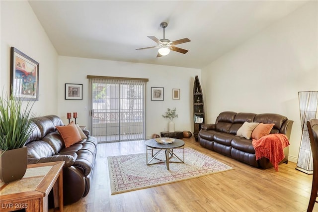 living room featuring ceiling fan and wood finished floors