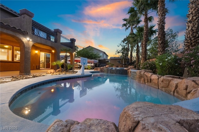 4200 Scott Peak Ct, Las Vegas, NV 89129 - pool at dusk with a pool with connected hot tub