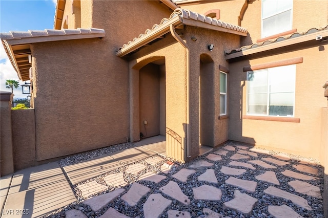 4200 Scott Peak Ct, Las Vegas, NV 89129 - rear view of house featuring stucco siding, a tile roof, and a patio