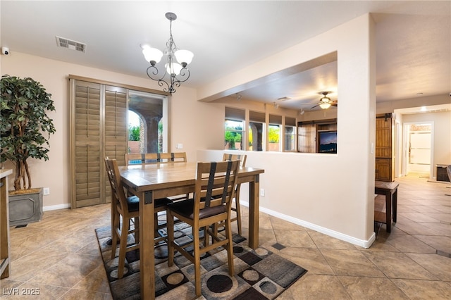 4200 Scott Peak Ct, Las Vegas, NV 89129 - dining area with tile patterned floors, baseboards, a chandelier, and a ceiling fan