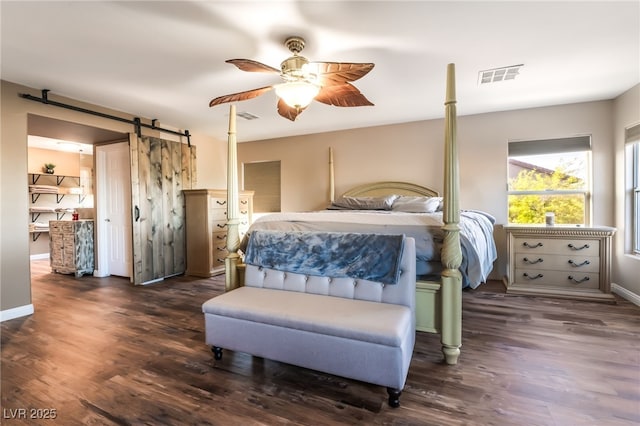 4200 Scott Peak Ct, Las Vegas, NV 89129 - bedroom with wood finished floors, a barn door, ceiling fan, and baseboards