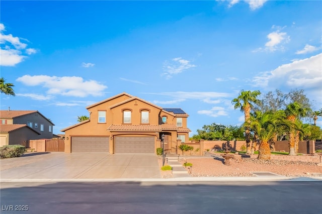 4200 Scott Peak Ct, Las Vegas, NV 89129 - mediterranean / spanish-style home featuring roof mounted solar panels, fence, driveway, stucco siding, and an attached garage