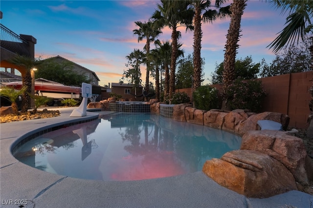 4200 Scott Peak Ct, Las Vegas, NV 89129 - pool at dusk with fence and a pool with connected hot tub