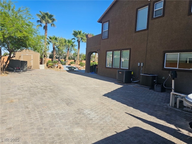 4200 Scott Peak Ct, Las Vegas, NV 89129 - view of patio / terrace featuring central AC unit, a shed, and an outdoor structure