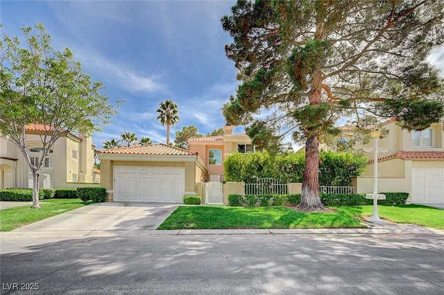 8221 Crow Valley Ln, Las Vegas, NV 89113 - mediterranean / spanish house with stucco siding, concrete driveway, a tile roof, and an attached garage