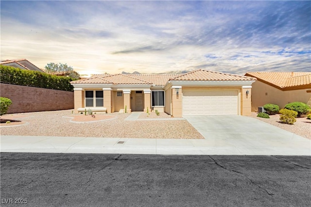 2205 Beacon Ridge Dr, Las Vegas, NV 89134 - view of front of house with an attached garage, a tile roof, stucco siding, and driveway