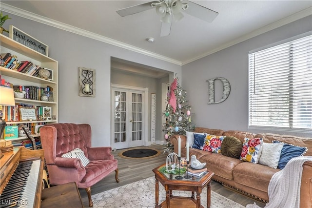 living room featuring french doors, ceiling fan, wood finished floors, and plenty of natural light