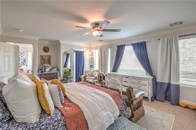 bedroom featuring visible vents, ornamental molding, and multiple windows