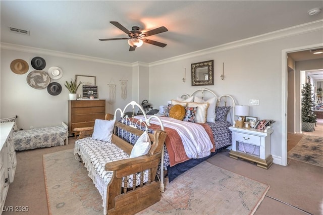 bedroom with carpet flooring, a ceiling fan, visible vents, and ornamental molding