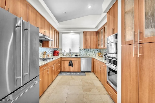 465 Indigo Springs St, Henderson, NV 89014 - kitchen featuring decorative backsplash, appliances with stainless steel finishes, a sink, light countertops, and under cabinet range hood