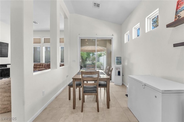465 Indigo Springs St, Henderson, NV 89014 - dining room featuring light tile patterned floors, high vaulted ceiling, visible vents, and baseboards